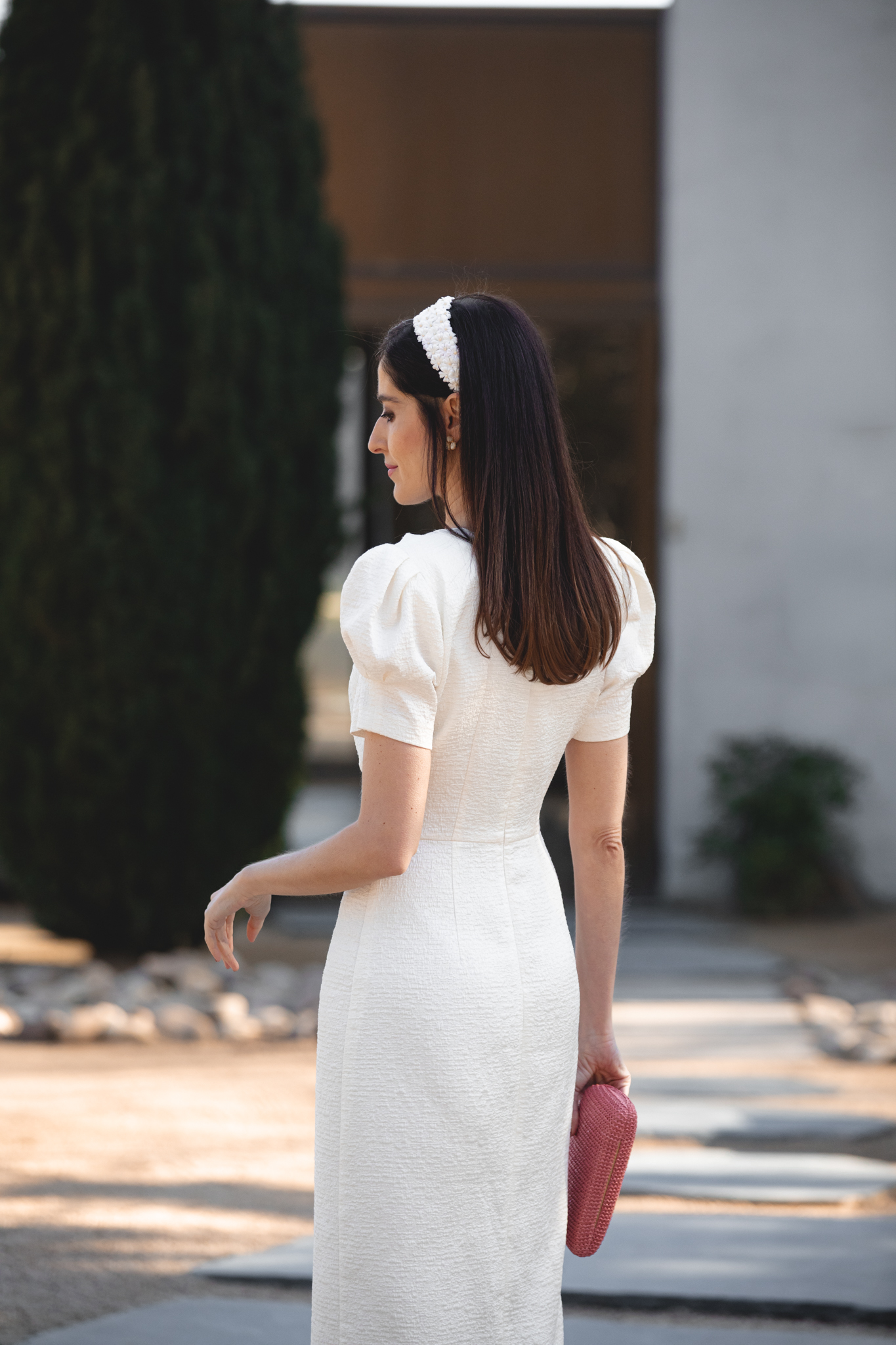 Espalda de vestido blanco de manga farol para comunion